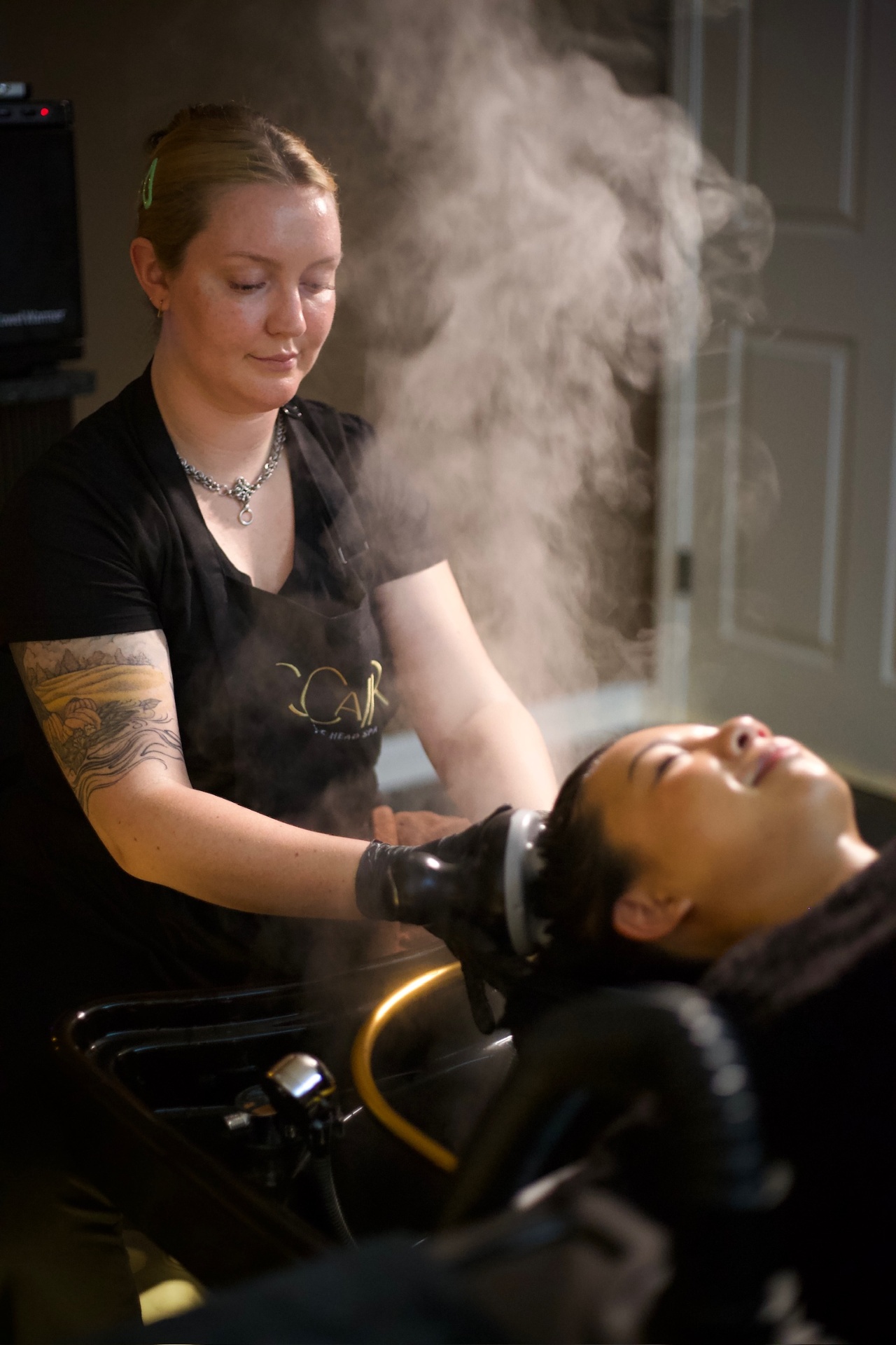 SCaIR therapist performing a Japanese head spa treatment